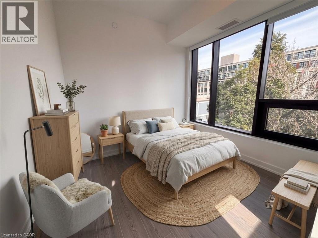 Virtually staged. Expansive window wall with black framing, wood-finish flooring, and white painted walls