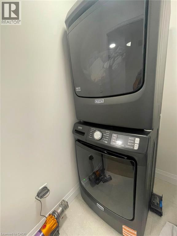 Stacked washer and dryer unit