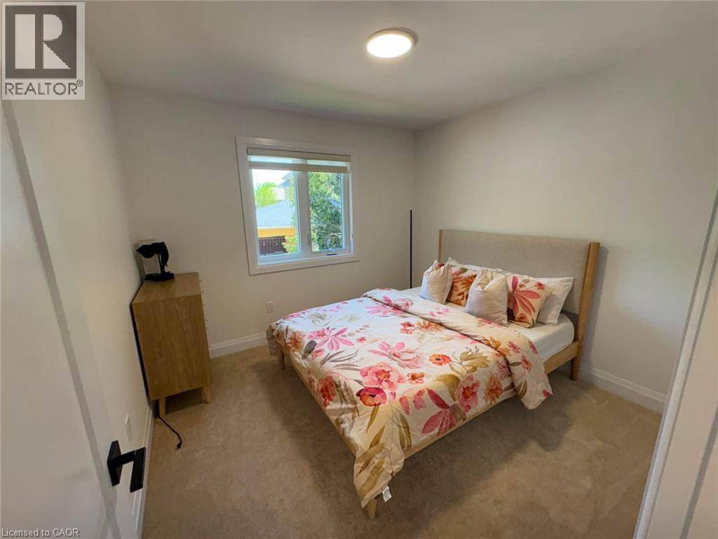 Recessed window with white trim, wall-to-wall carpeting, and a flush-mount ceiling light
