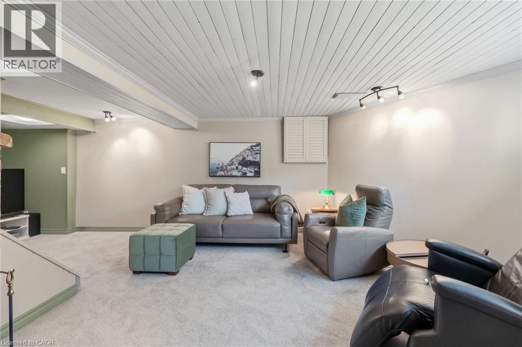 Recessed and track lighting illuminate a textured plank ceiling
