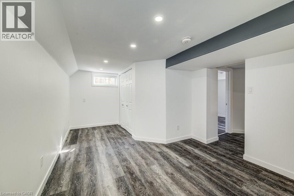 Interior space featuring wood-finish flooring, recessed lighting, and a white bi-fold closet door