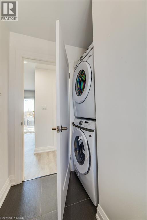 Integrated stacked washer and dryer in a dedicated utility closet