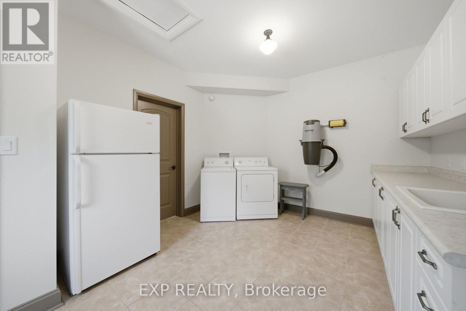 Main floor laundry/mudroom with lots of storage