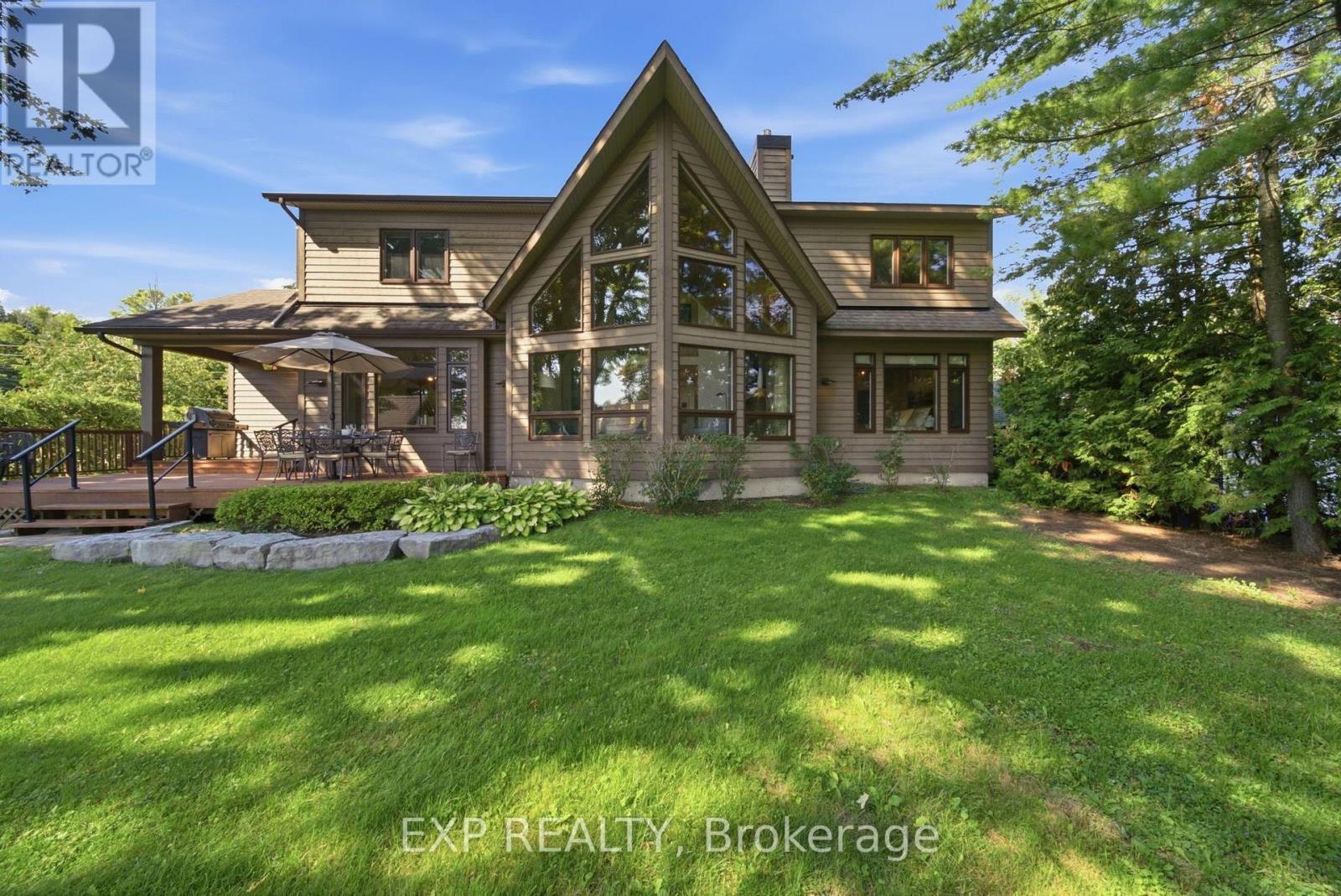 Striking lakeside elevation and lawn