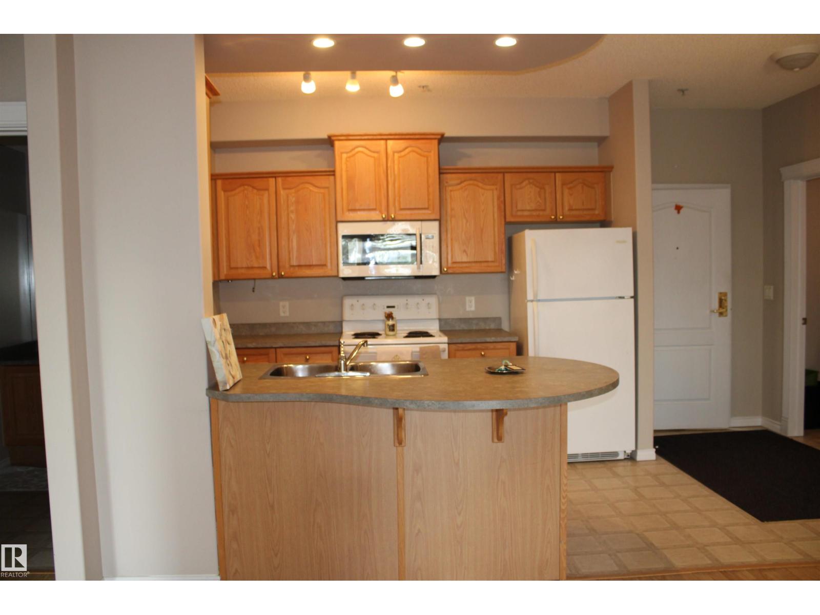 #212 14259 50 ST N NW photo 4