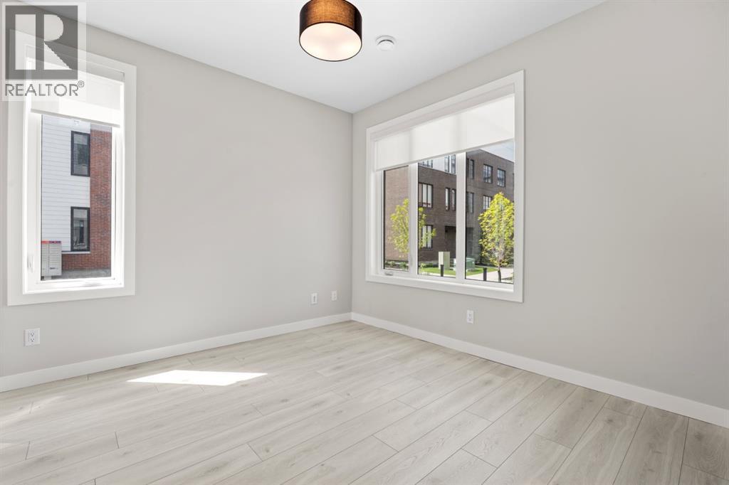 203, 8155 8 Avenue SW, Calgary, Alberta  T3H 6B1 - Photo 3 - A2318061