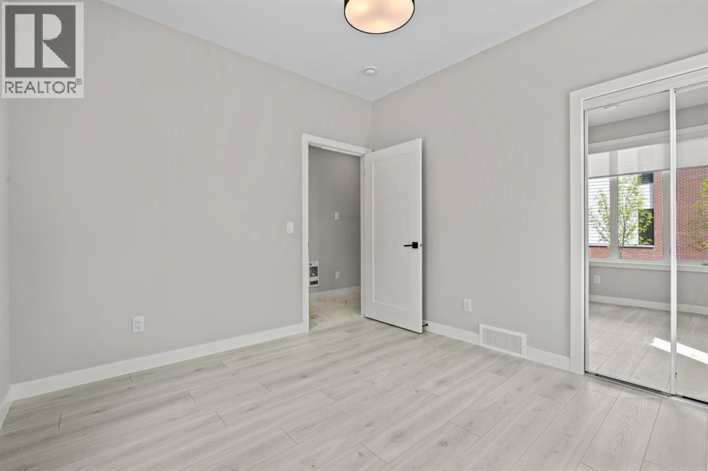203, 8155 8 Avenue SW, Calgary, Alberta  T3H 6B1 - Photo 4 - A2318061