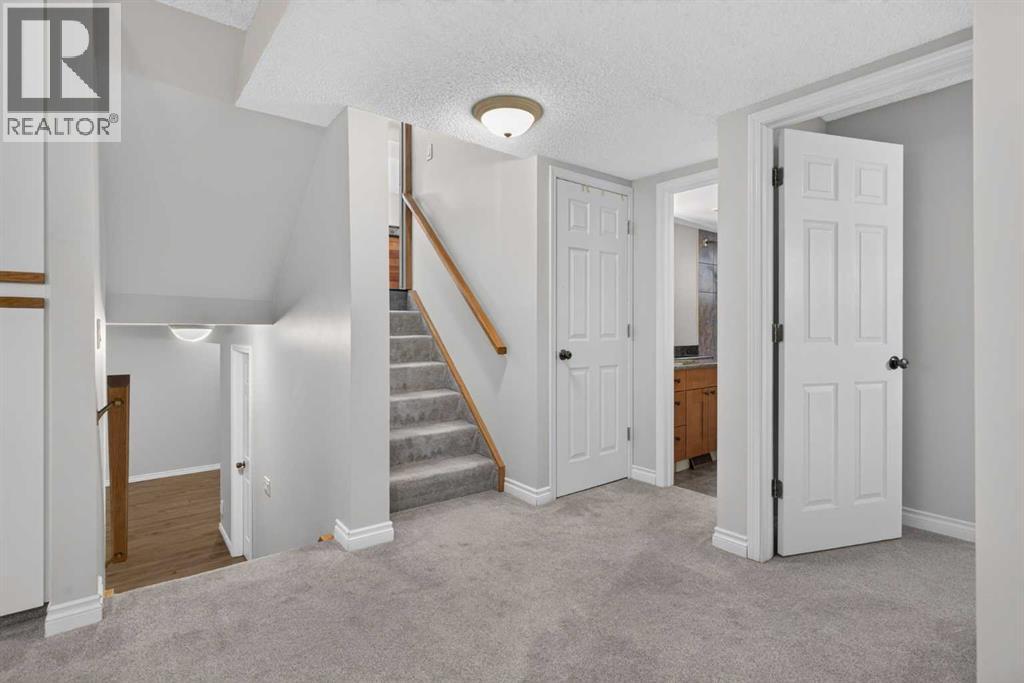 112 Beaconsfield Rise NW, Calgary, Alberta  T3K 1X4 - Photo 24 - A2347791