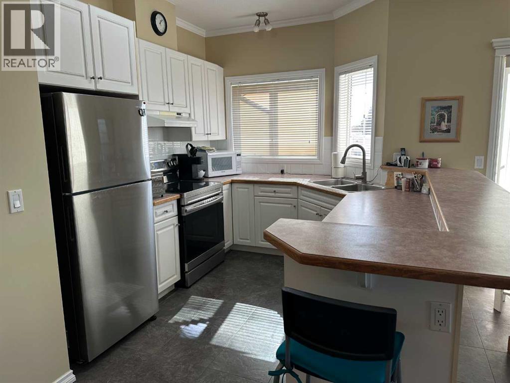 303, 1902 23 Street, Didsbury, Alberta  T0M 0W0 - Photo 5 - A2347146