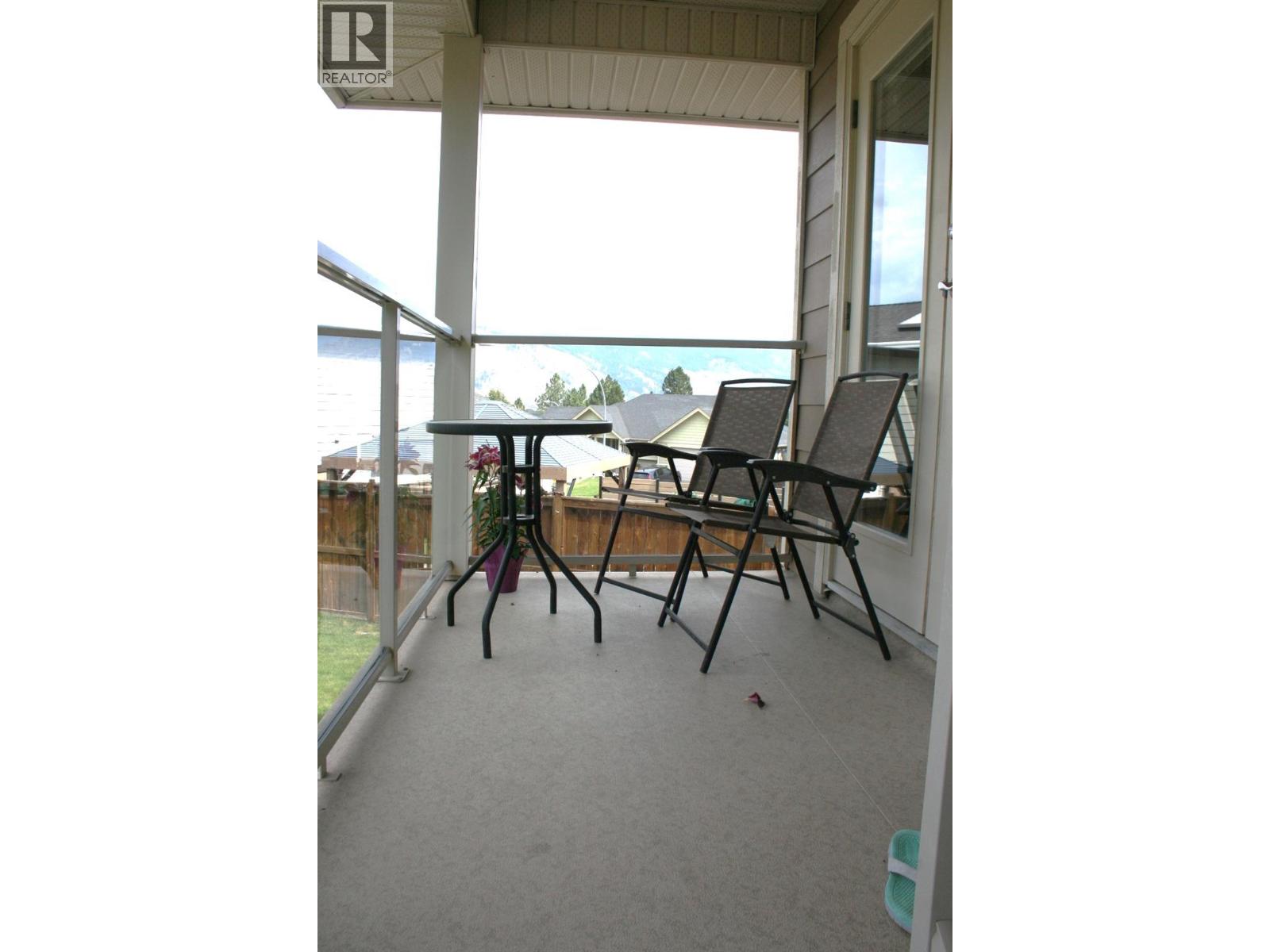 Upper covered patio off Kitchen