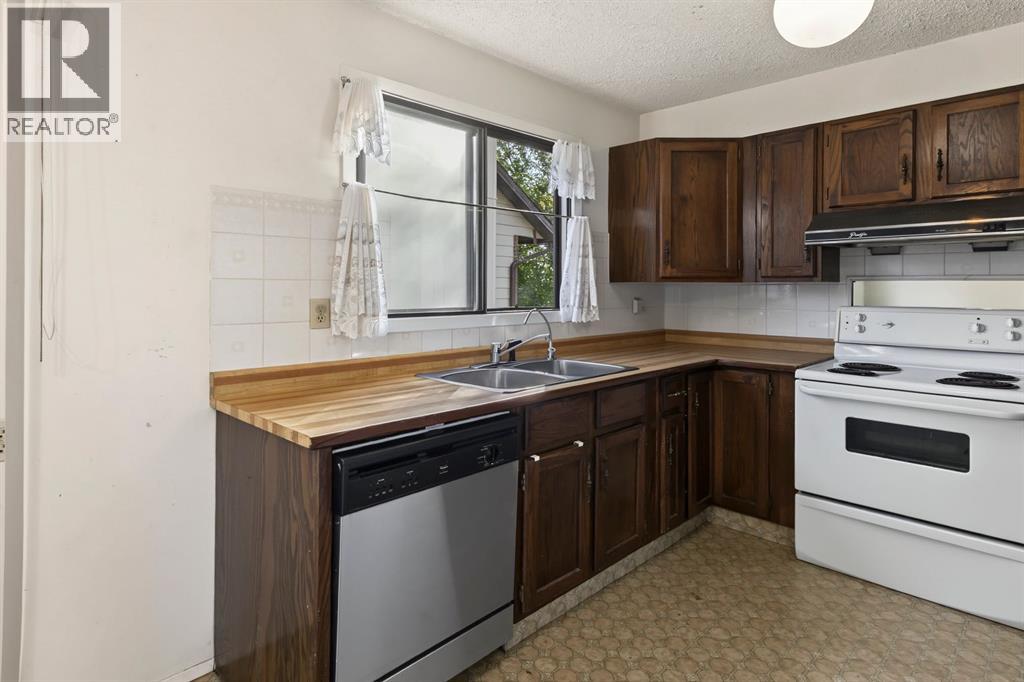 1272 Berkley Drive NW, Calgary, Alberta  T3K 1S9 - Photo 11 - A2342496