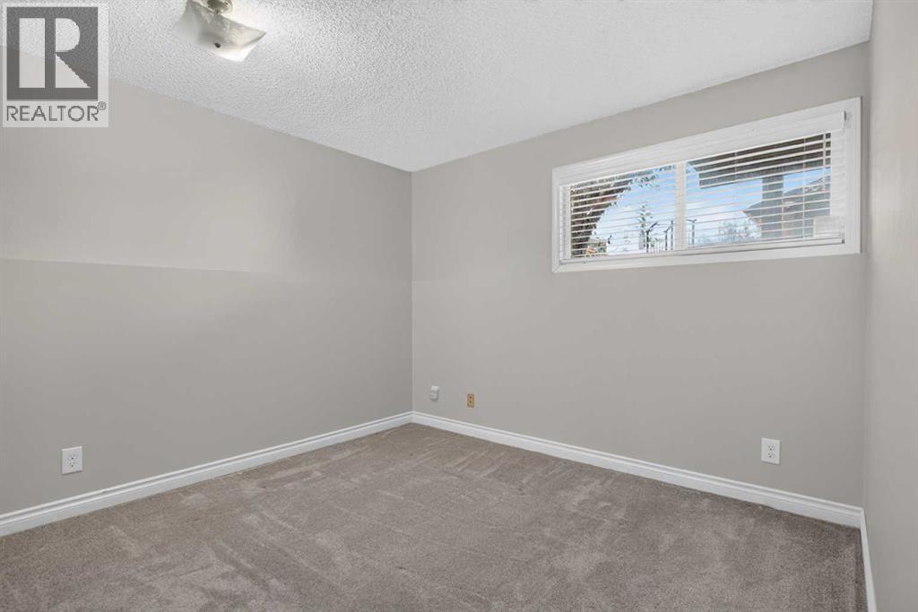 112 Beaconsfield Rise Nw, Calgary, Alberta  T3K 1X4 - Photo 28 - A2347791