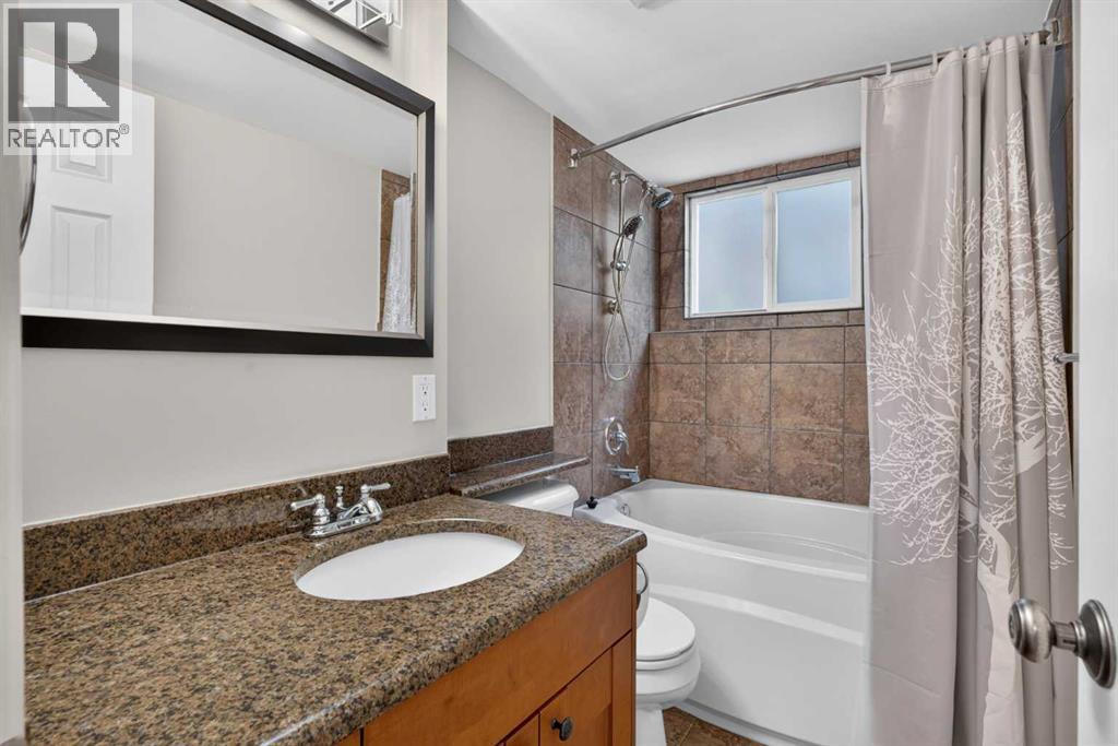 112 Beaconsfield Rise Nw, Calgary, Alberta  T3K 1X4 - Photo 30 - A2347791