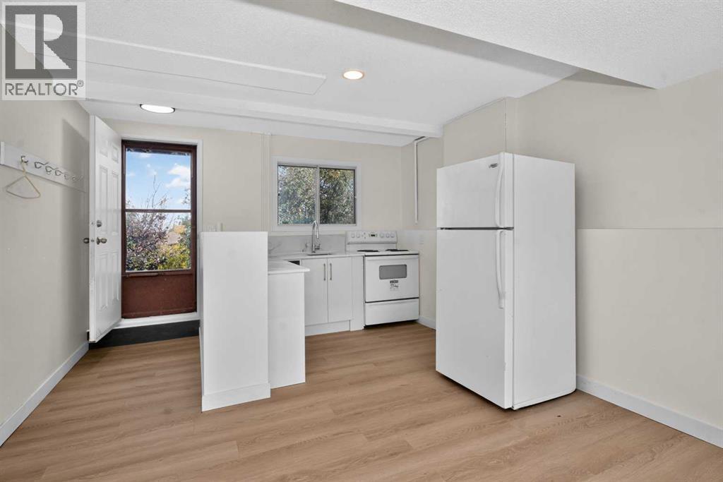 63 Beaconsfield Crescent Nw, Calgary, Alberta T3K 1W5 - Photo 24 - A2349926