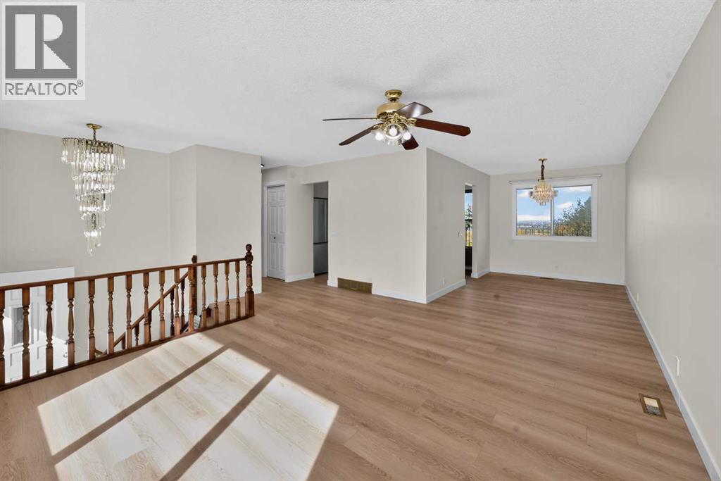 63 Beaconsfield Crescent Nw, Calgary, Alberta T3K 1W5 - Photo 5 - A2349926