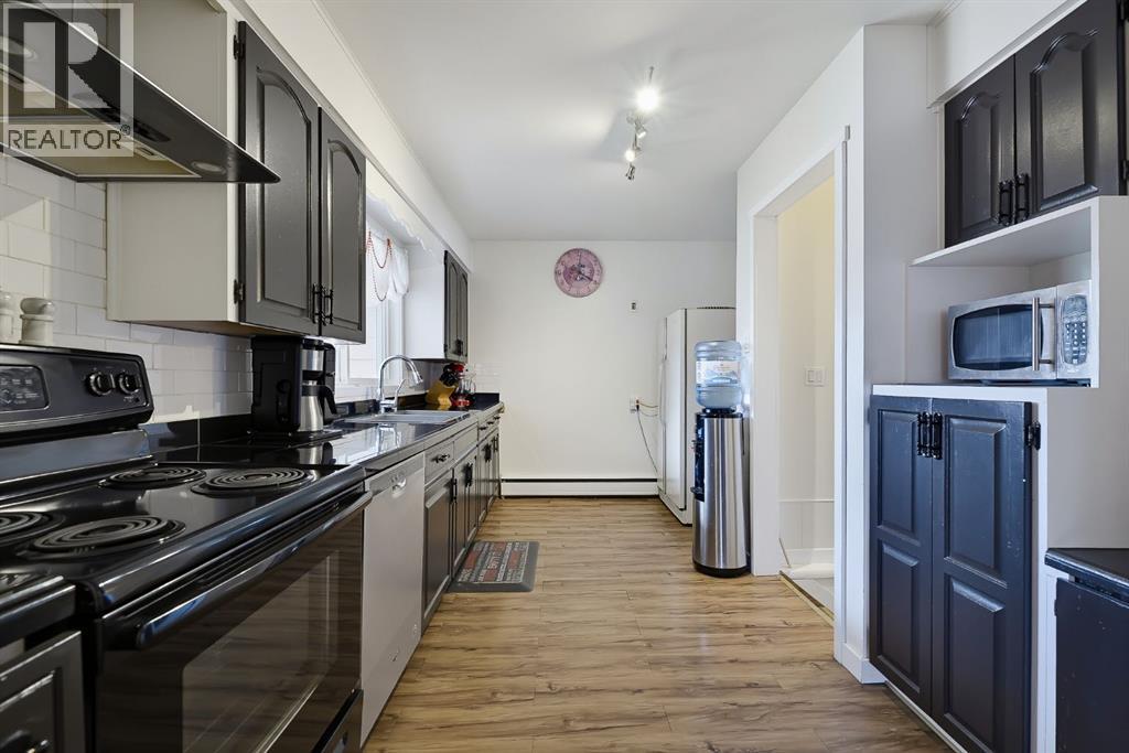 704 75 Avenue Sw, Calgary, Alberta  T2V 0S3 - Photo 10 - A2348452