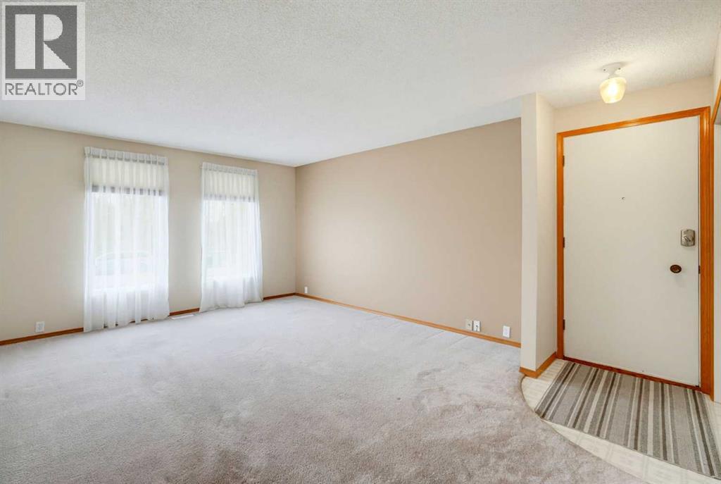 8007 Huntington Street Ne, Calgary, Alberta T2K 5B8 - Photo 3 - A2346689