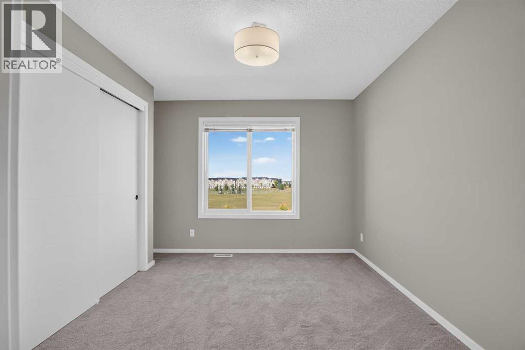 203, 315 Redstone Walk NE