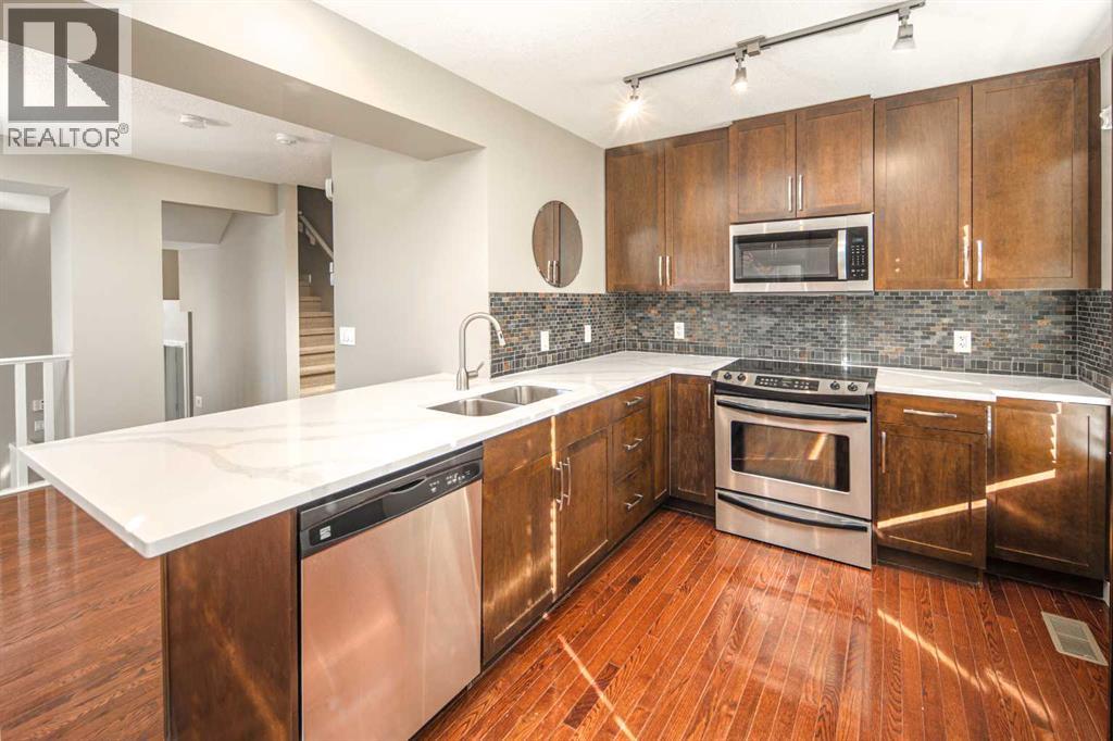 158 Aspen Hills Villas SW, Calgary, Alberta  T3H 0H7 - Photo 2 - A2346605