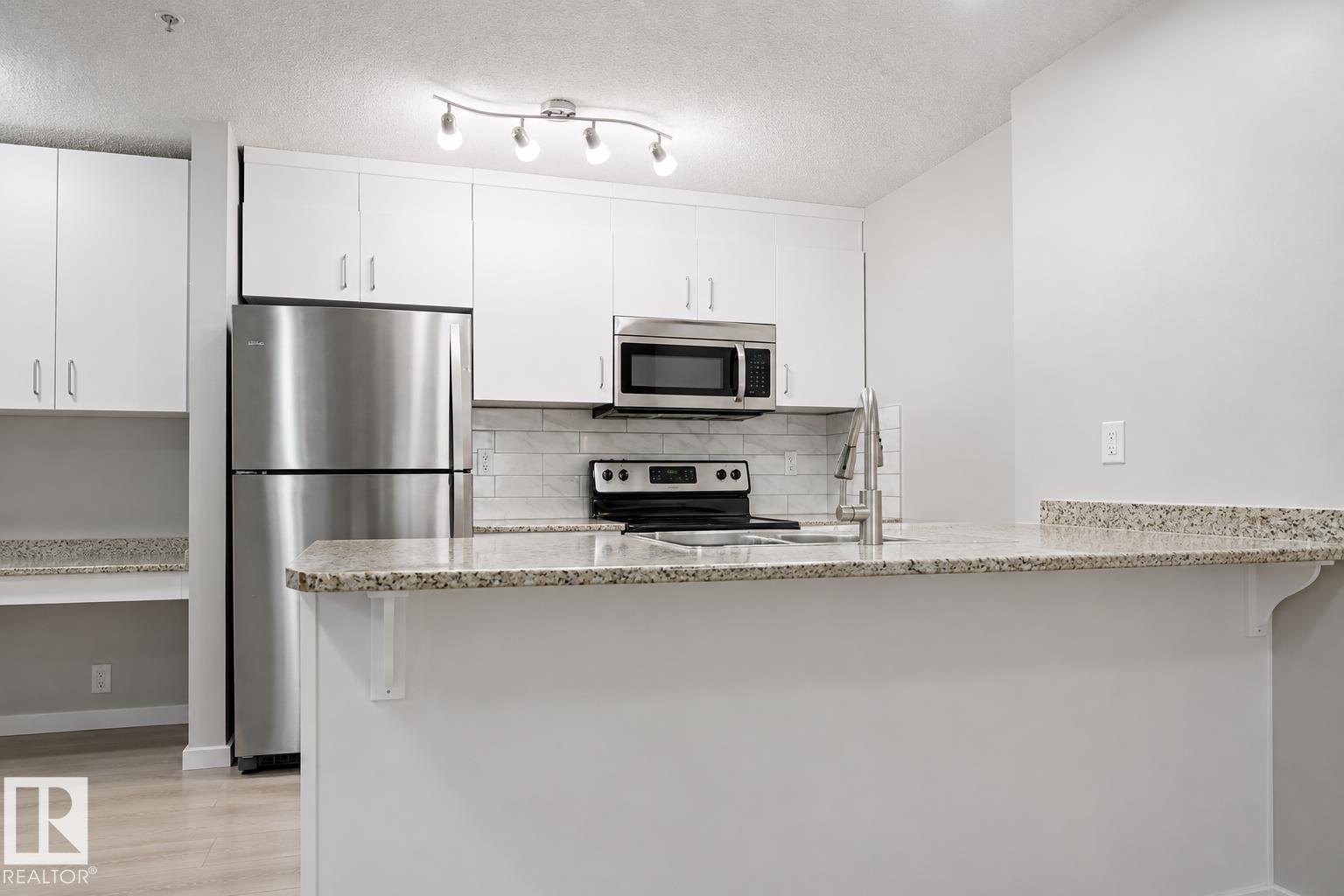 #127 5515 7 AV SW