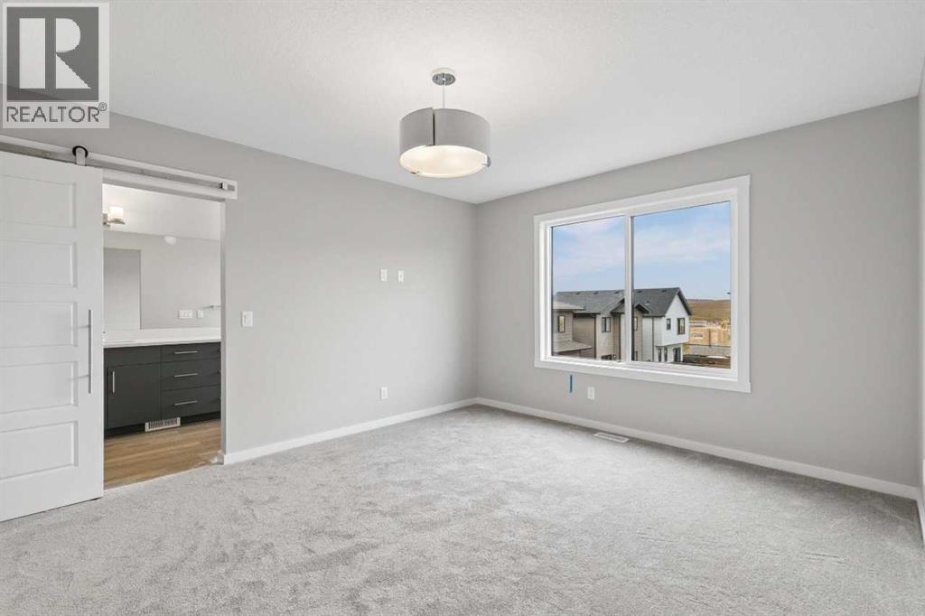 111 Heritage Ridge, Cochrane, Alberta  T4C 2J8 - Photo 24 - A2348731