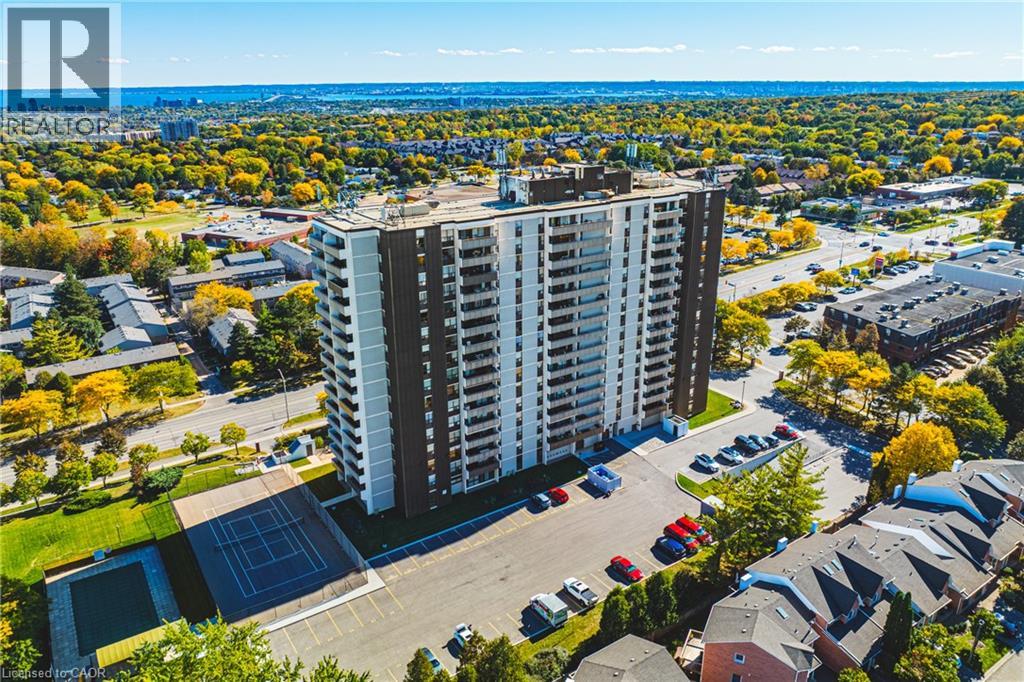 Let the spectacular south-facing views captivate you from your amazing 40-foot balcony, where the beauty of Mother Nature can soothe your soul. Step inside this bright & generously sized condo, where an open-concept layout creates the perfect setting for everyday living & entertaining.The spacious kitchen is sure to catch your attention, offering an inviting space to prepare meals while staying connected with family & guests. Whether you’re hosting a dinner party or enjoying casual drinks & snacks, this home makes entertaining effortless. This carpet-free 2-bdrm plus den condo has so much to offer. The versatile den provides the perfect spot to curl up with a good book, enjoy your favourite show, or create a comfortable home office. With both a 3-piece and 4-piece bthrm, there’s plenty of convenience for everyone from a long, leisurely soak to a quick & refreshing walk-in shower. Wake up to the same breathtaking south-facing view that first captured your heart. The spacious primary bdrm features an ensuite bthrm and his-and-hers closets, creating a comfortable and private retreat. The generously sized second bdrm is conveniently located across the hall from the additional bathroom, making it ideal for family members or overnight guests. Enjoy the added convenience of an ensuite laundry room with ample storage space, keeping everyday essentials organized & easily accessible. Ideally located within walking distance to shopping, public transit, parks, &places of worship, with quick access to the highway for easy commuting & connectivity. The building also offers a vibrant sense of community, making it more than just a place to live it’s a place to call home.The condo fee is all-inclusive, covering heat, hydro, water, central air conditioning, Bell Fibe TV, a portion of internet service, exterior maintenance, building insurance, common elements, parking, & guest parking.Experience comfort, convenience, spectacular views, & community all in one exceptional package. (id:48254)