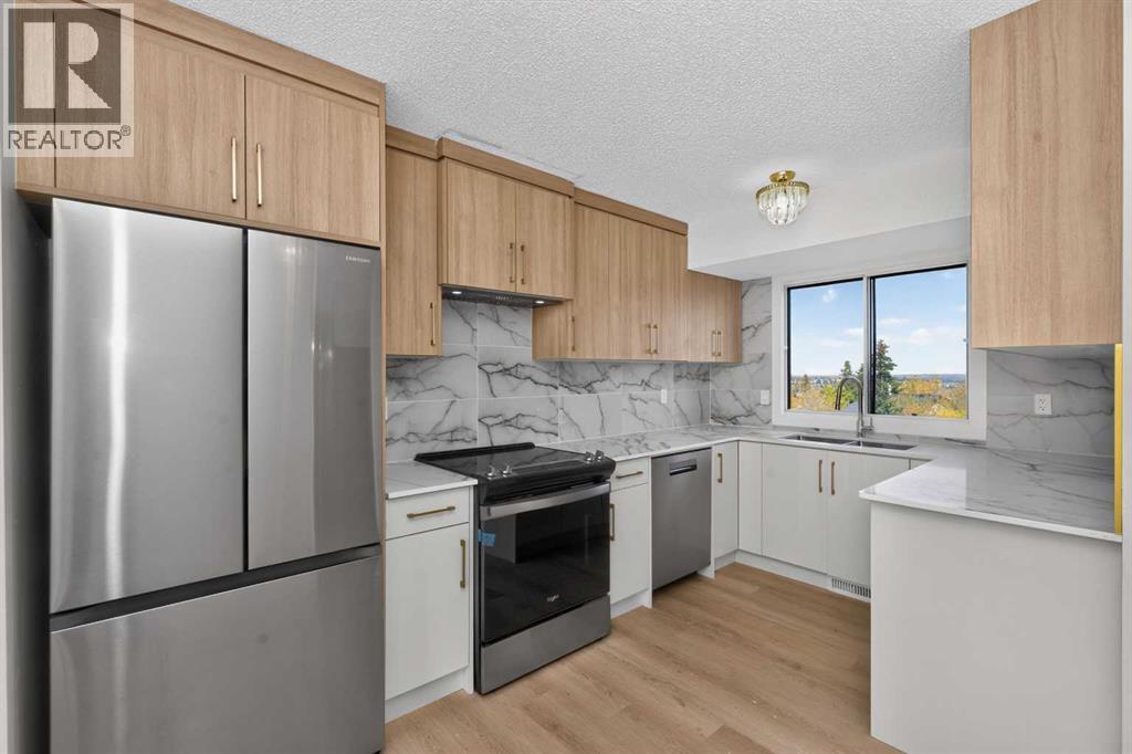 63 Beaconsfield Crescent NW, Calgary, Alberta  T3K 1W5 - Photo 7 - A2349926