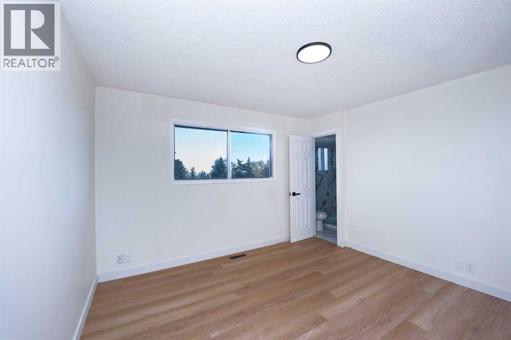 63 Beaconsfield Crescent NW, Calgary, Alberta  T3K 1W5 - Photo 16 - A2349926