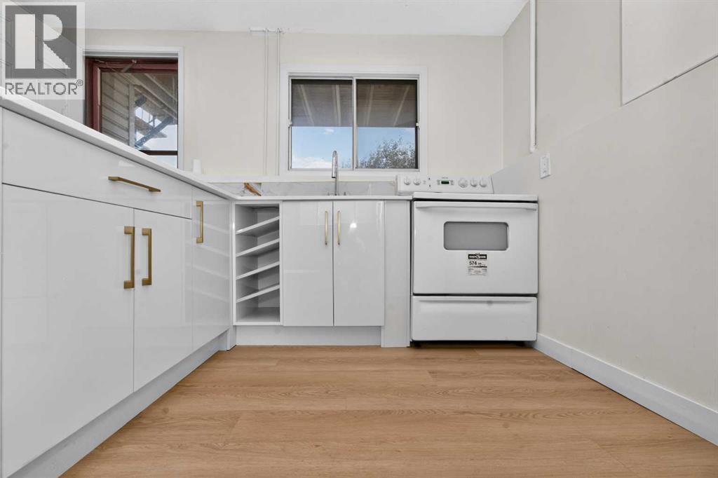 63 Beaconsfield Crescent NW, Calgary, Alberta  T3K 1W5 - Photo 25 - A2349926
