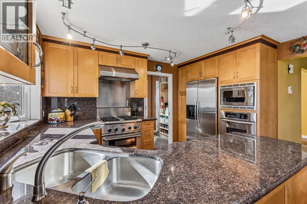 19 Woodbrook Road SW, Calgary, Alberta  T2W 4M5 - Photo 10 - A2351285