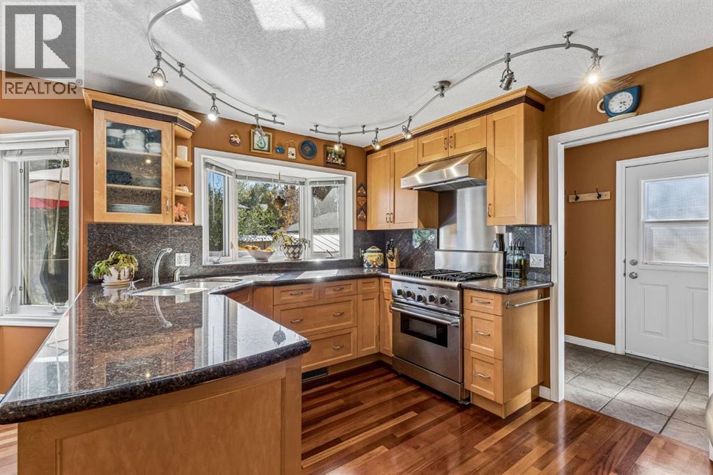 19 Woodbrook Road SW, Calgary, Alberta  T2W 4M5 - Photo 6 - A2351285