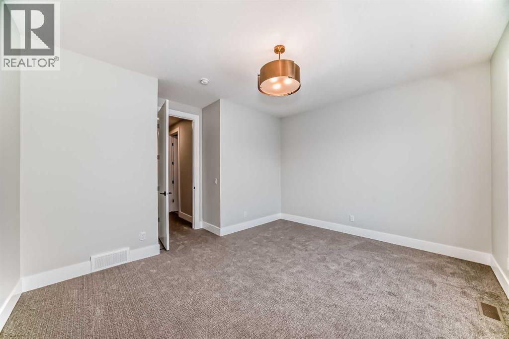 386 Spring Creek Circle Sw, Calgary, Alberta  T3H 6G4 - Photo 21 - A2351614