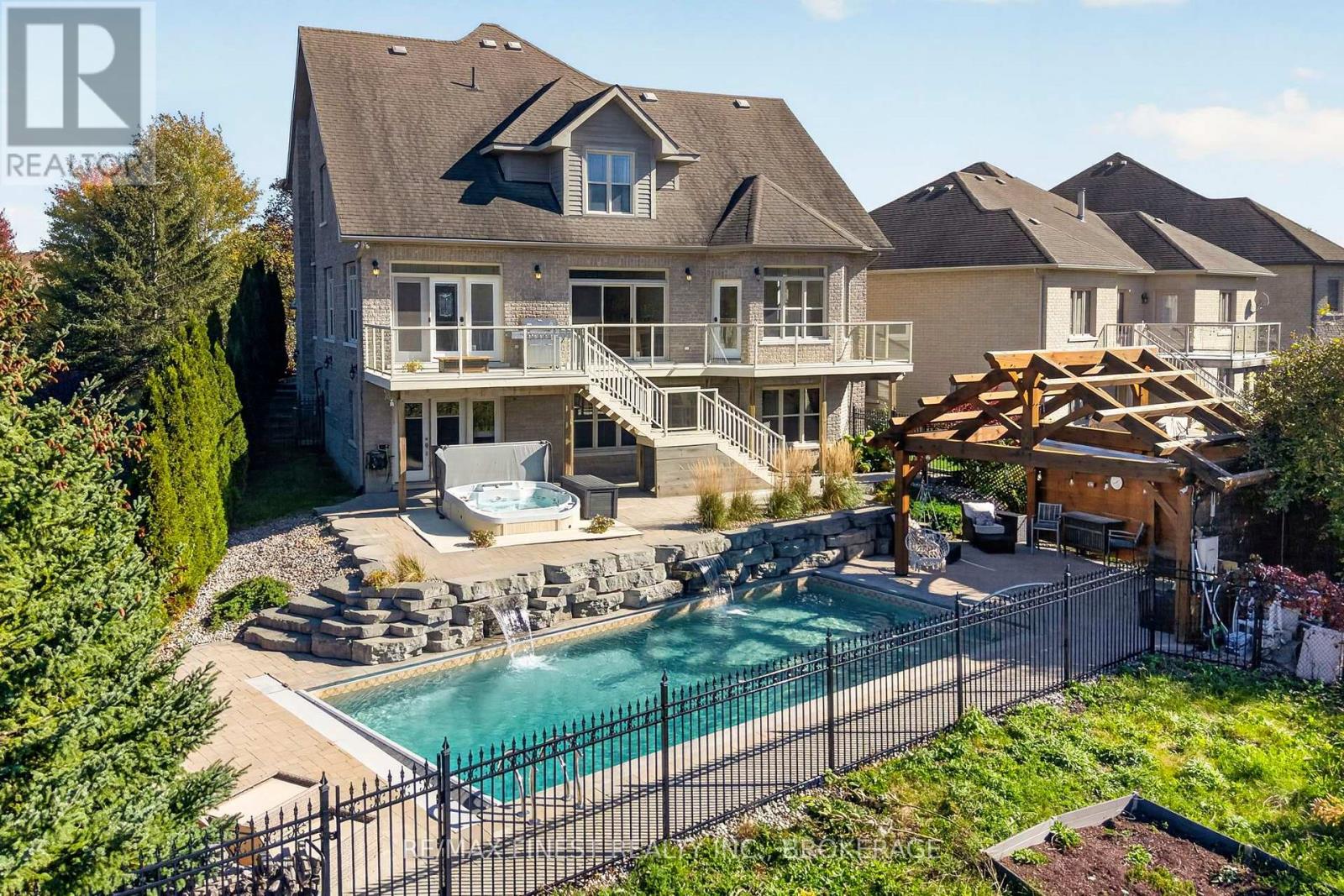 Welcome to an irreplaceable sanctuary in Kingston! Positioned at the end of a peaceful cul-de-sac with only one neighbour, 710 Kananaskis Drive borders protected meadows, pristine forest, and a natural waterfall, ensuring your views and total privacy remain preserved forever! Constructed with an ICF foundation for superior climate control and soundproofing, the home blends grand architecture with effortless daily living. Over 4500 sq feet of finished space unfolds across light filled interiors, highlighted by 19 foot ceilings, custom stonework, grand curved maple staircase and expansive sightlines to the surrounding nature. The gourmet kitchen and formal dining area make entertaining seamless, while the main floor primary suite offers single level convenience with dual walk in closets and direct deck access as well as a large ensuite bathroom. The lower walk out level serves as an ultimate entertainment hub, complete with in floor radiant heat, a private gym, a state of the art home theatre space, and guest quarters. Outside, the backyard transforms into a world class private resort, featuring a heated inground pool, infinity hot tub, heated outdoor lounge area, and movie projection space. Complete with an EV ready, heated garage featuring a commercial hydraulic lift, this rare estate delivers an unmatched lifestyle! With so many amazing features and upgrades throughout, you will need to view this property in person! (id:48254)