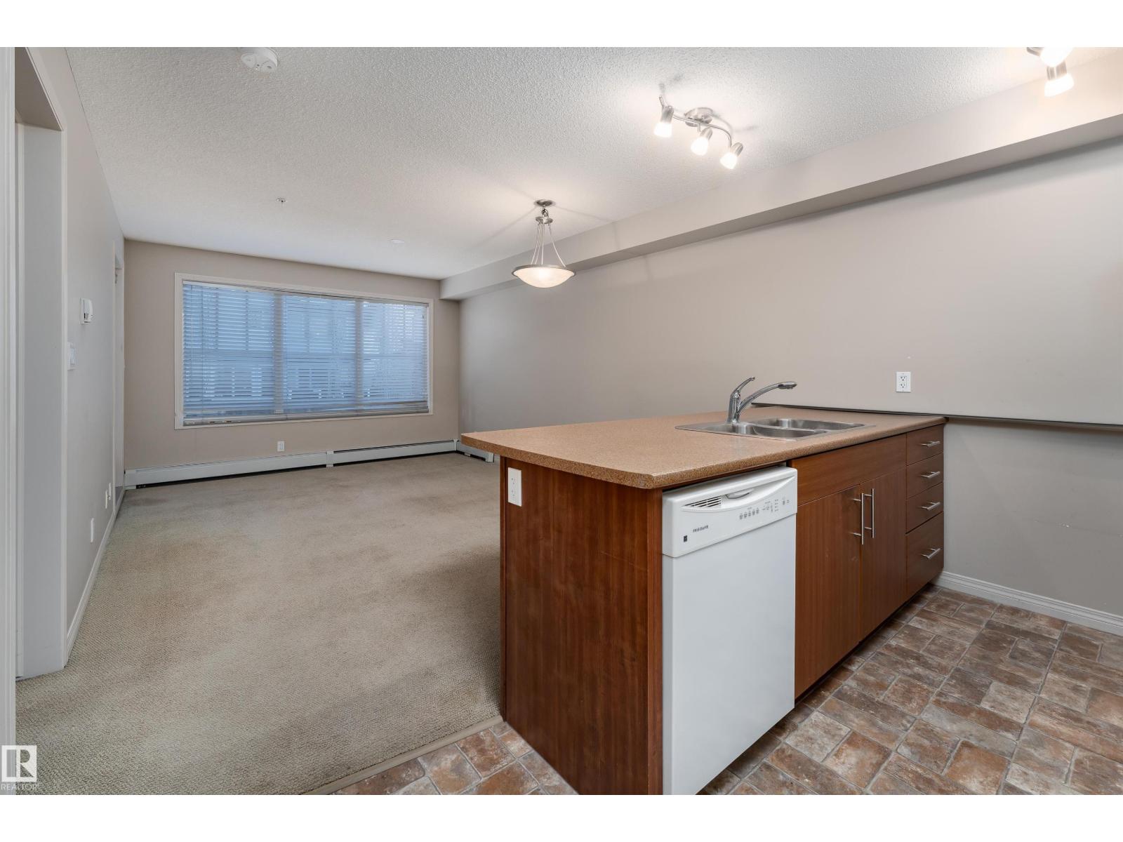 #202 105 AMBLESIDE DR SW