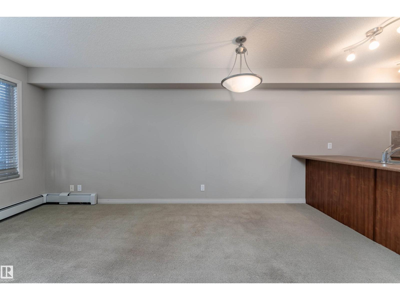 #202 105 AMBLESIDE DR SW