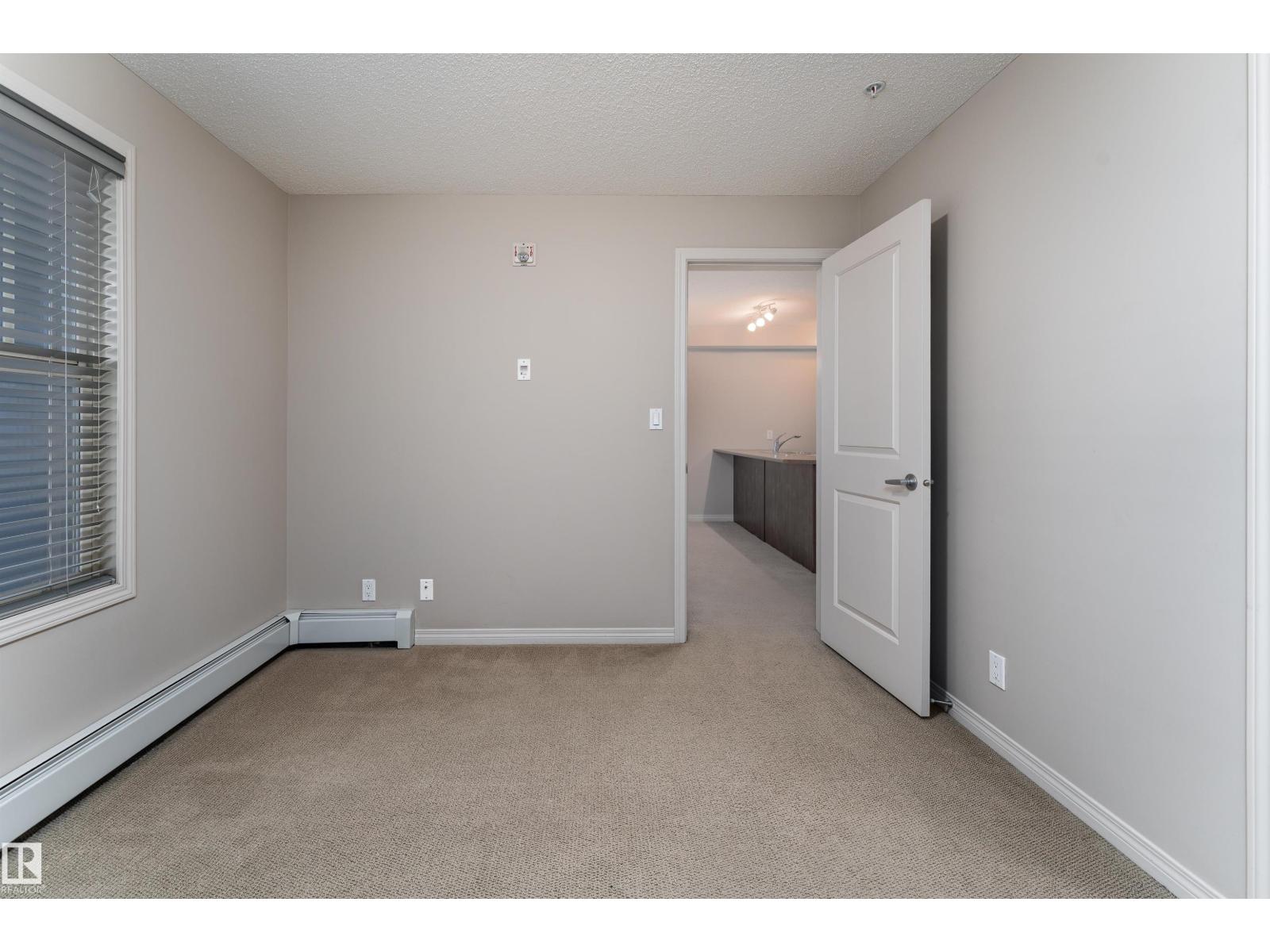 #202 105 AMBLESIDE DR SW