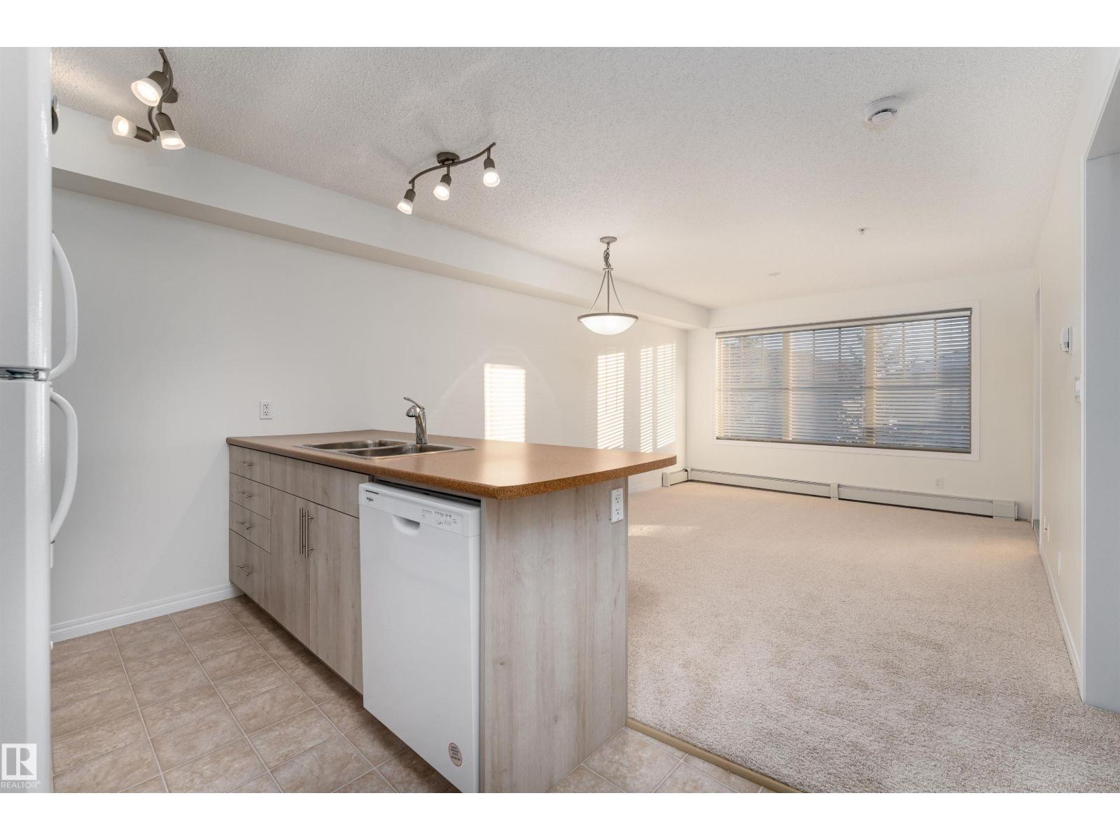 #303 105 AMBLESIDE DR SW