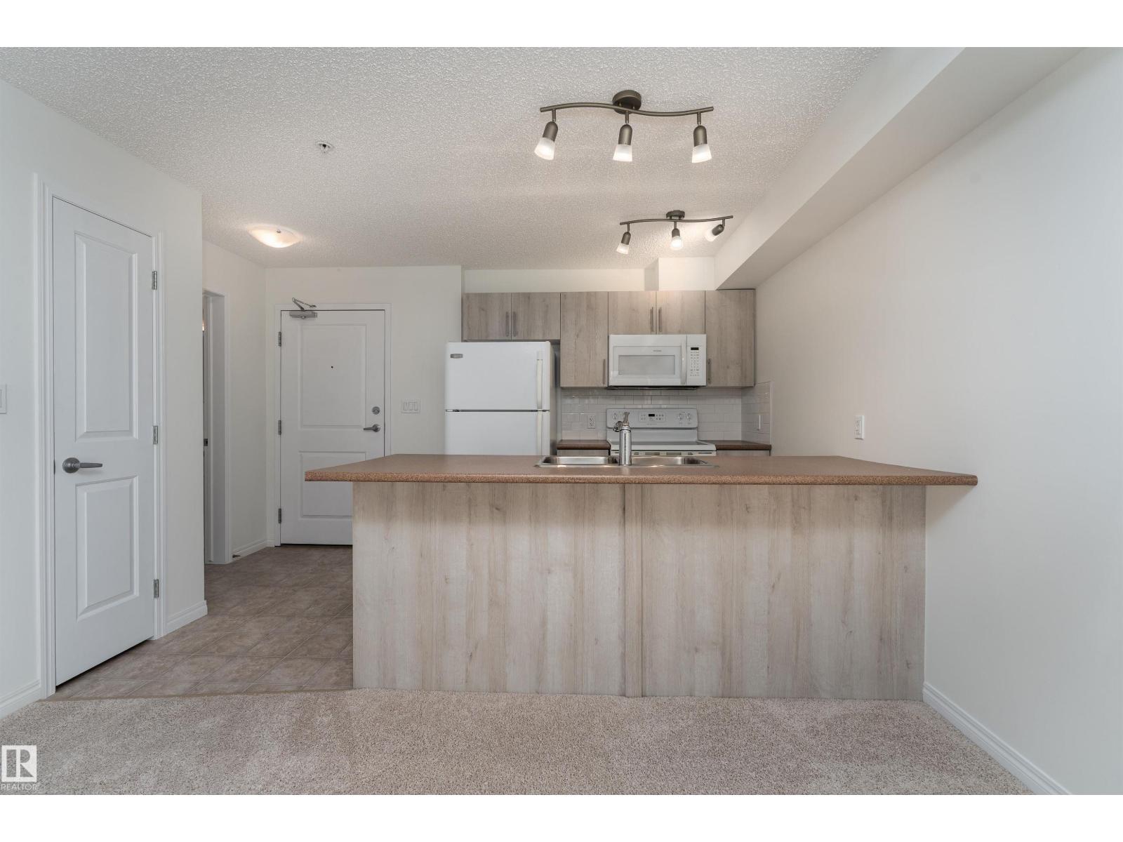 #303 105 AMBLESIDE DR SW