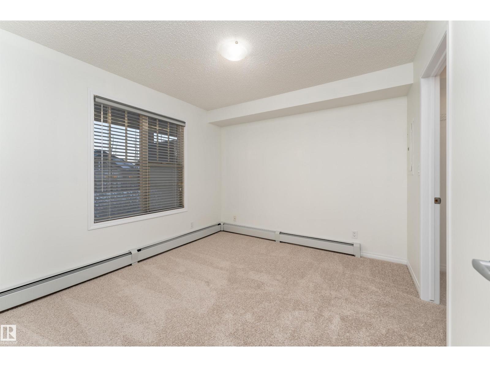 #303 105 AMBLESIDE DR SW