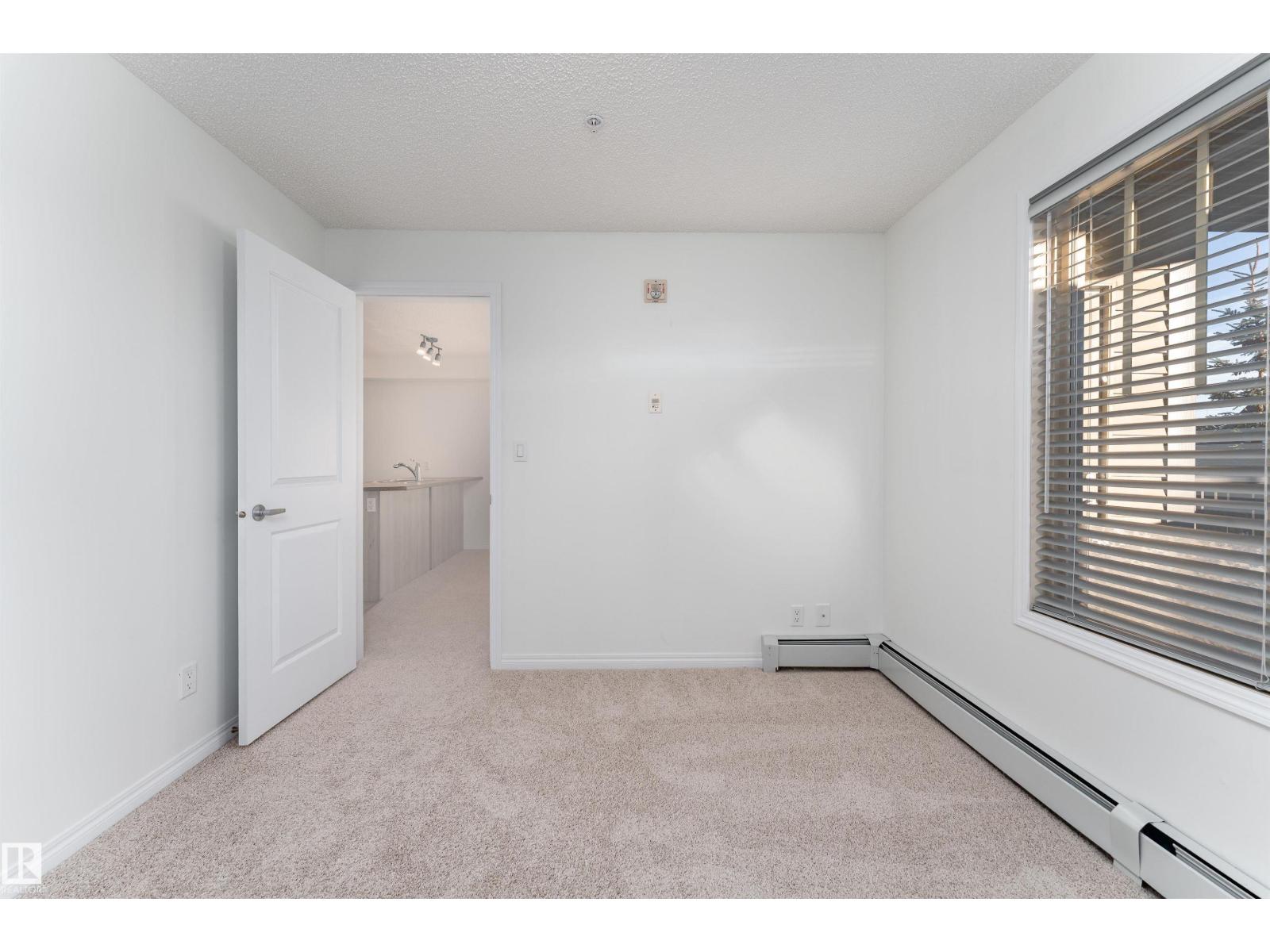 #303 105 AMBLESIDE DR SW