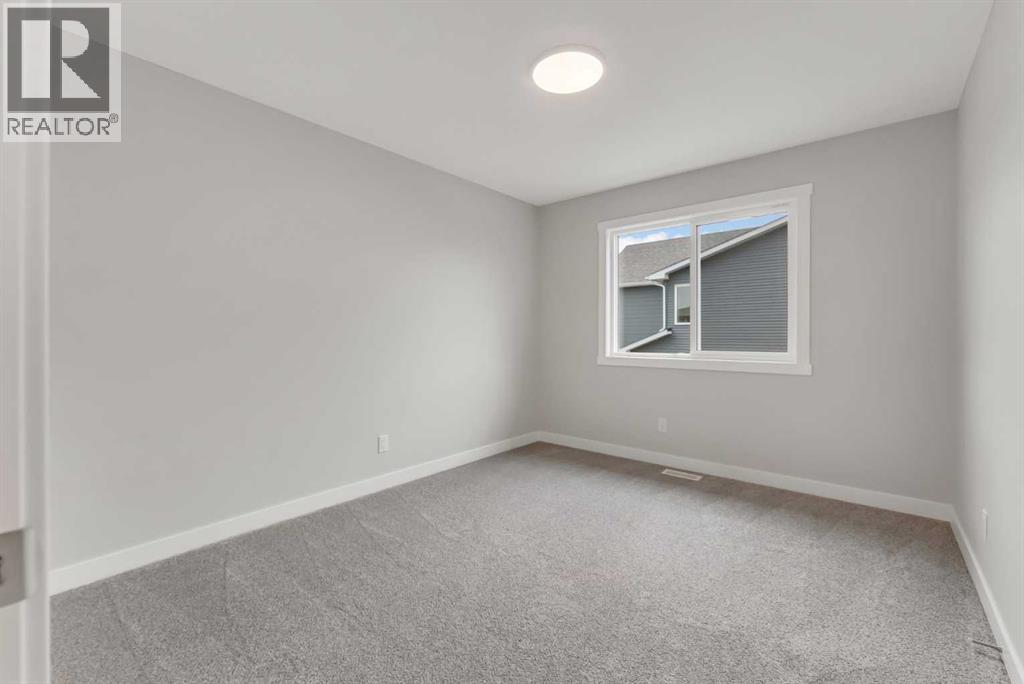 27 Creekside Rise Sw, Calgary, Alberta  T2X 5V9 - Photo 30 - A2338861