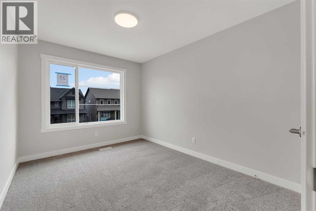 27 Creekside Rise Sw, Calgary, Alberta  T2X 5V9 - Photo 33 - A2338861