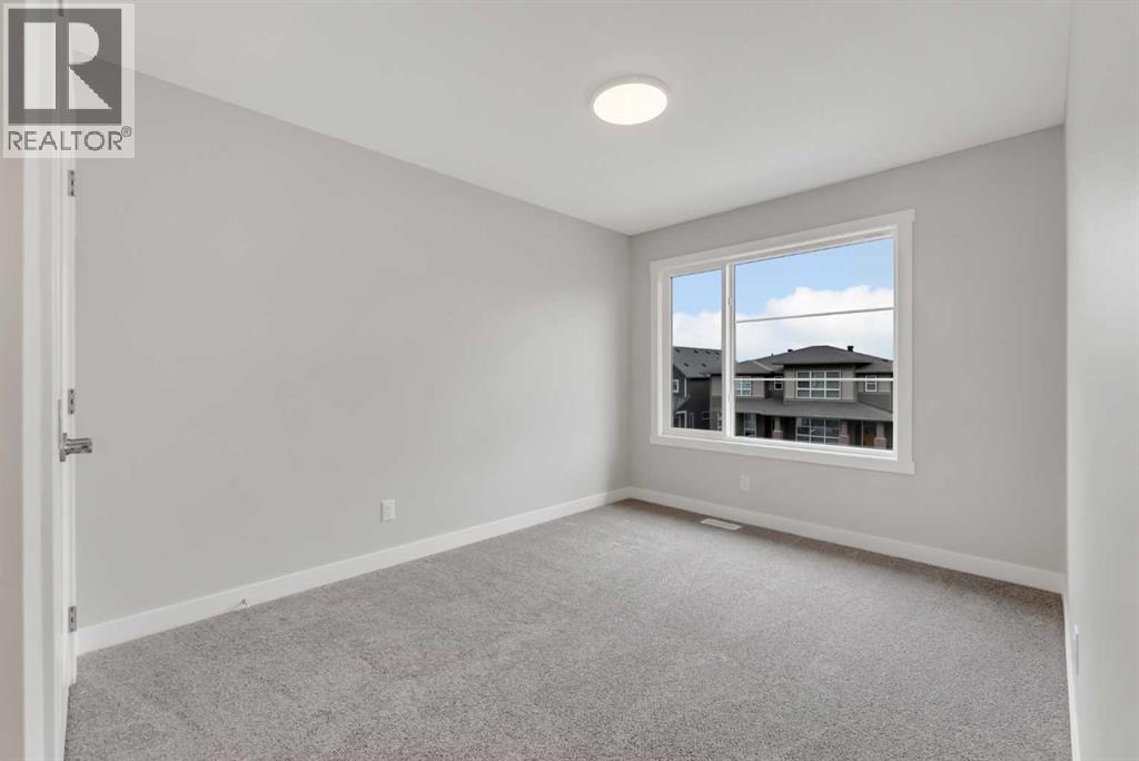 27 Creekside Rise Sw, Calgary, Alberta  T2X 5V9 - Photo 31 - A2338861