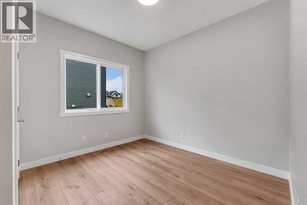 27 Creekside Rise Sw, Calgary, Alberta  T2X 5V9 - Photo 6 - A2338861