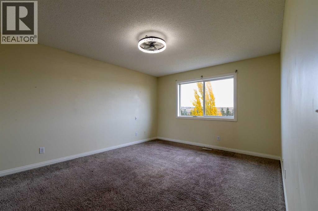 151 Bow Ridge Crescent, Cochrane, Alberta  T4C 1V2 - Photo 17 - A2351846
