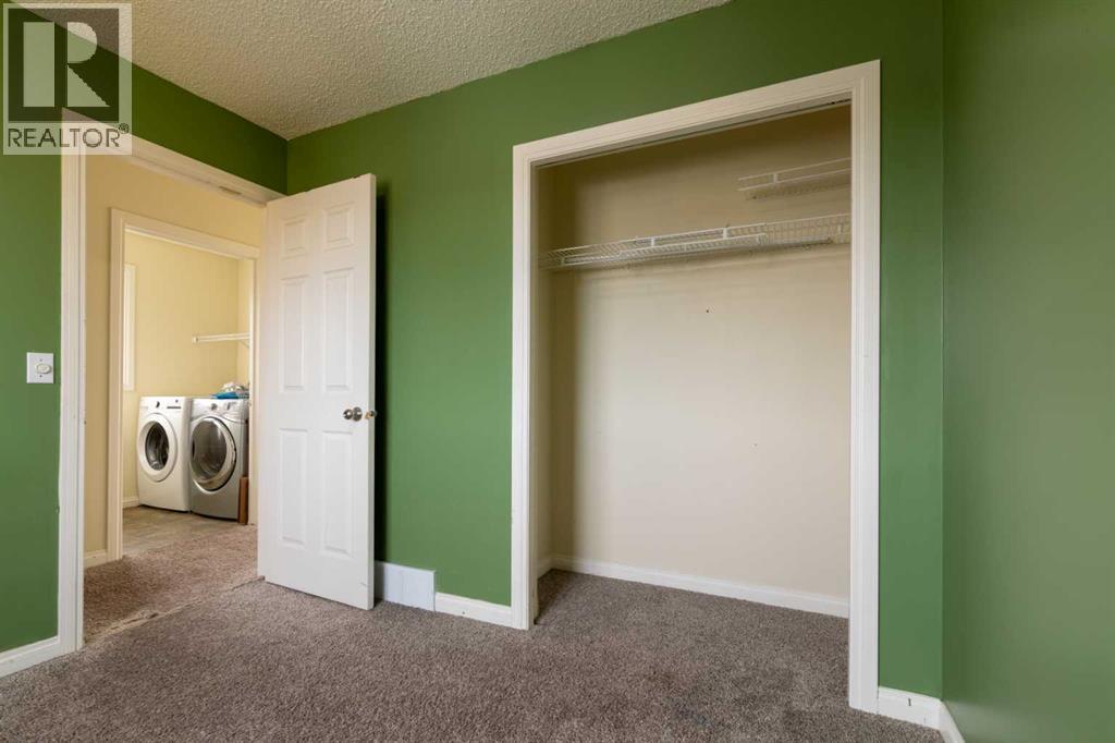 151 Bow Ridge Crescent, Cochrane, Alberta  T4C 1V2 - Photo 22 - A2351846
