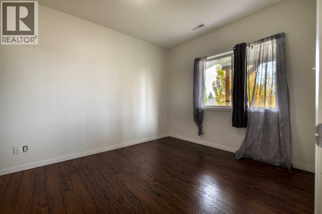 151 Bow Ridge Crescent, Cochrane, Alberta  T4C 1V2 - Photo 31 - A2351846