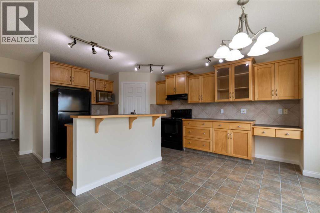 151 Bow Ridge Crescent, Cochrane, Alberta  T4C 1V2 - Photo 8 - A2351846
