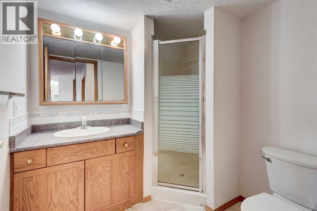 220, 7229 Sierra Morena Boulevard SW, Calgary, Alberta  T3H 3L8 - Photo 19 - A2345945