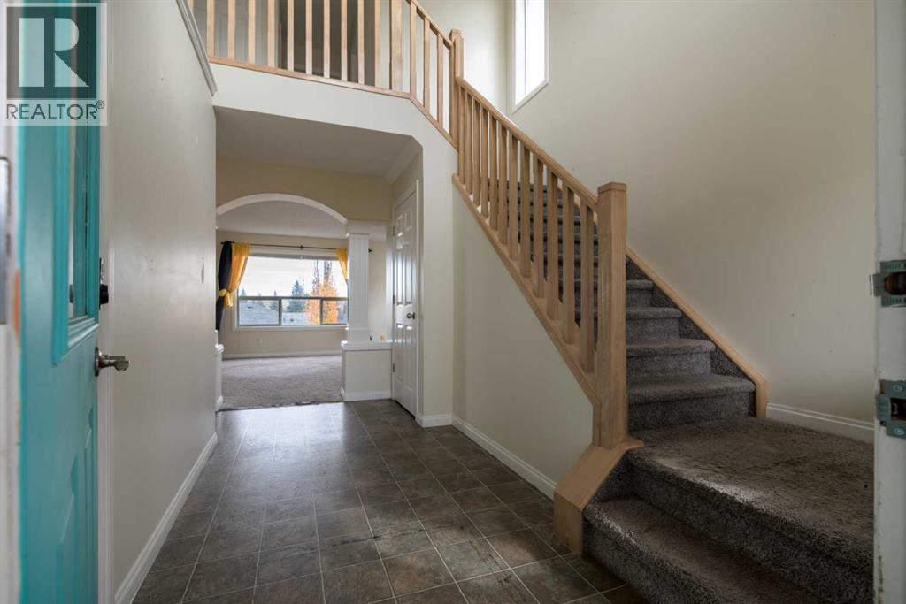 151 Bow Ridge Crescent, Cochrane, Alberta  T4C 1V2 - Photo 4 - A2351846